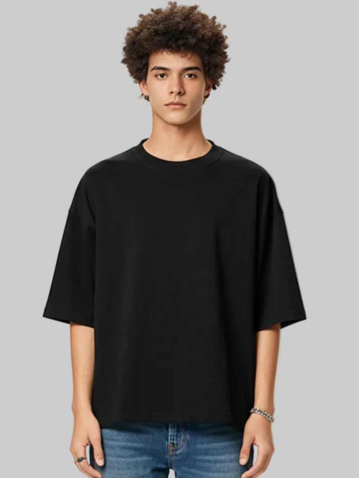 Person wearing a black t-shirt against a plain background