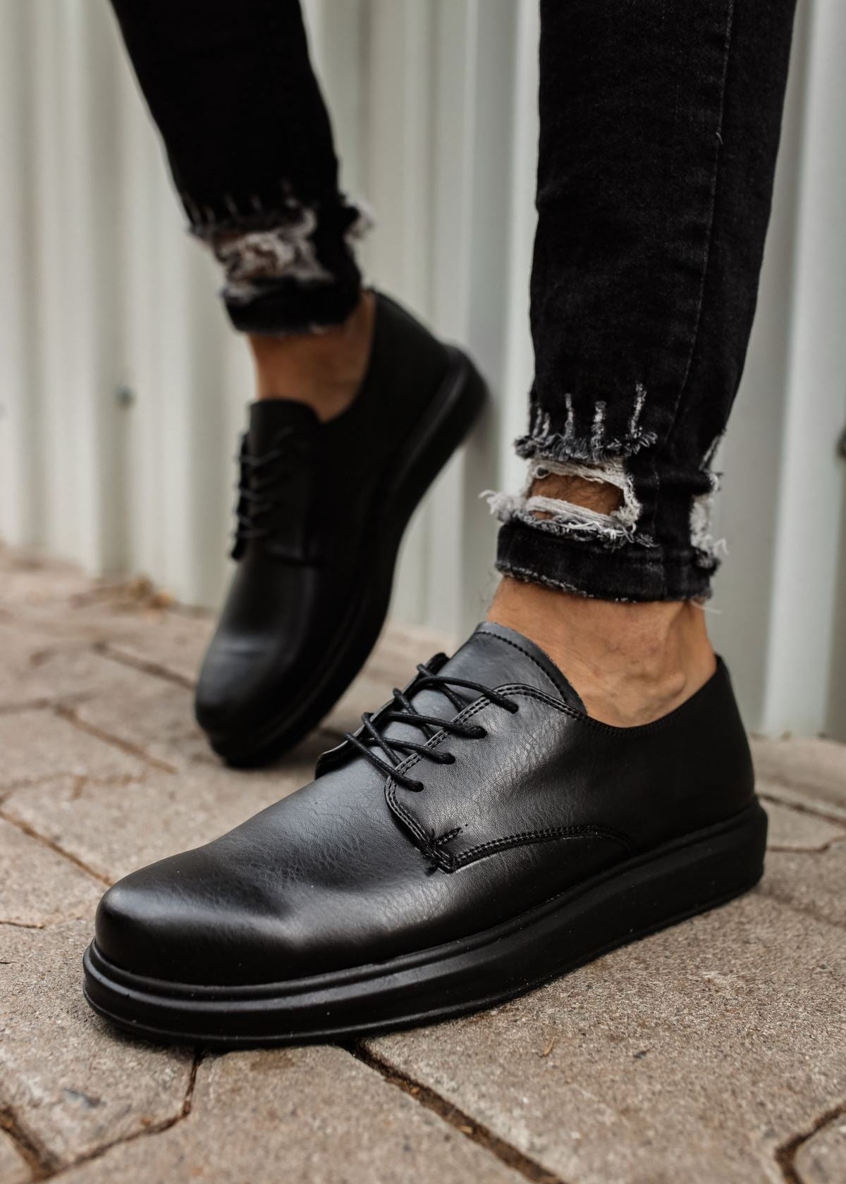Lazio Midnight Prestige lace-up dress shoe in black by Apollo Moda, worn outdoors
