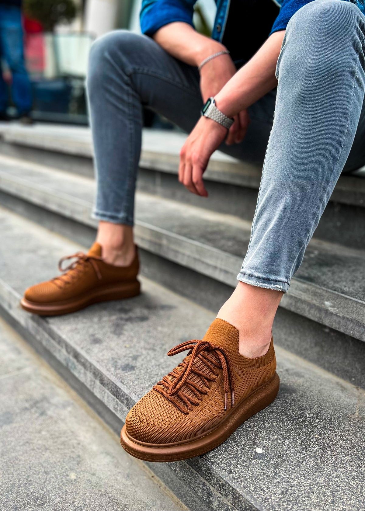 Torino Espresso Essence knit sneaker in brown by Apollo Moda, worn on concrete stairs