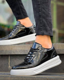 Men's Artemis Nova by Apollo Moda, glossy black sneaker with white accents, second angle
