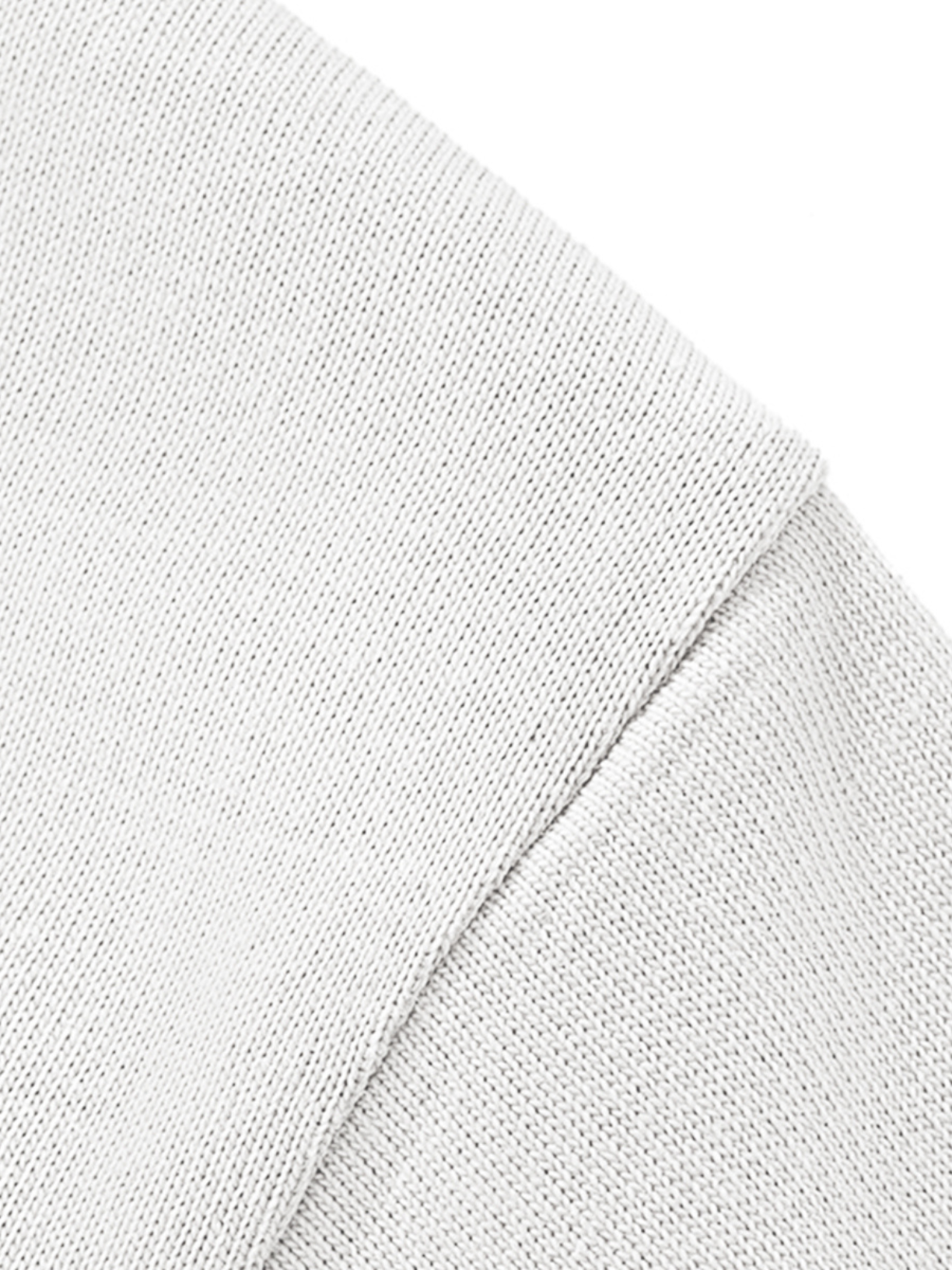 Aero boxy crop tee in white by Apollo Moda, close-up of the cotton fabric texture