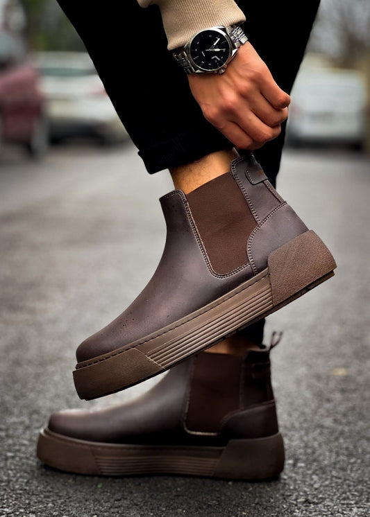 Avalon Coffee Brown Chelsea boot in brown by Apollo Moda, worn on wet pavement