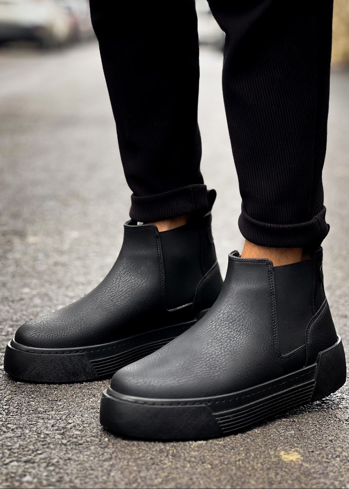 Avalon Onyx Chelsea boot in matte black by Apollo Moda, worn with cuffed trousers